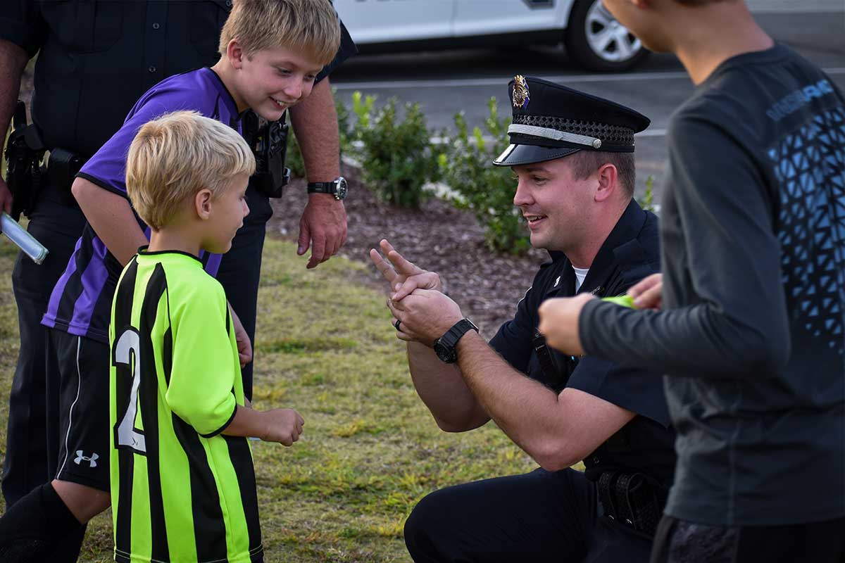 Police Officer playing with kids