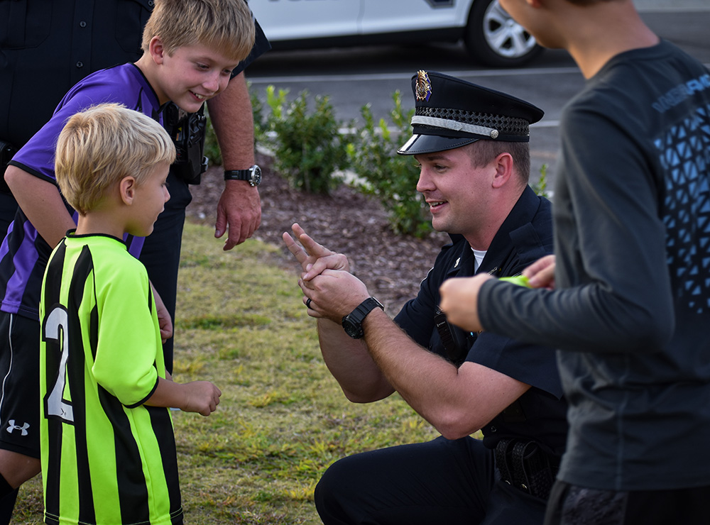 Police Officer talking with kids