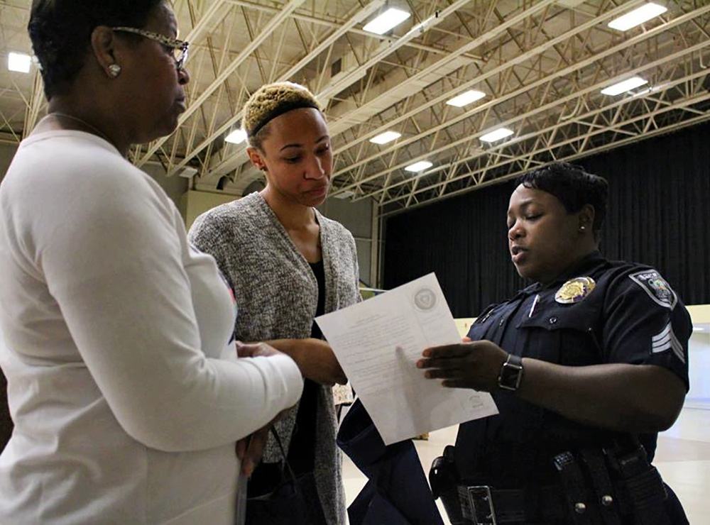 Police Officer speaking with two women